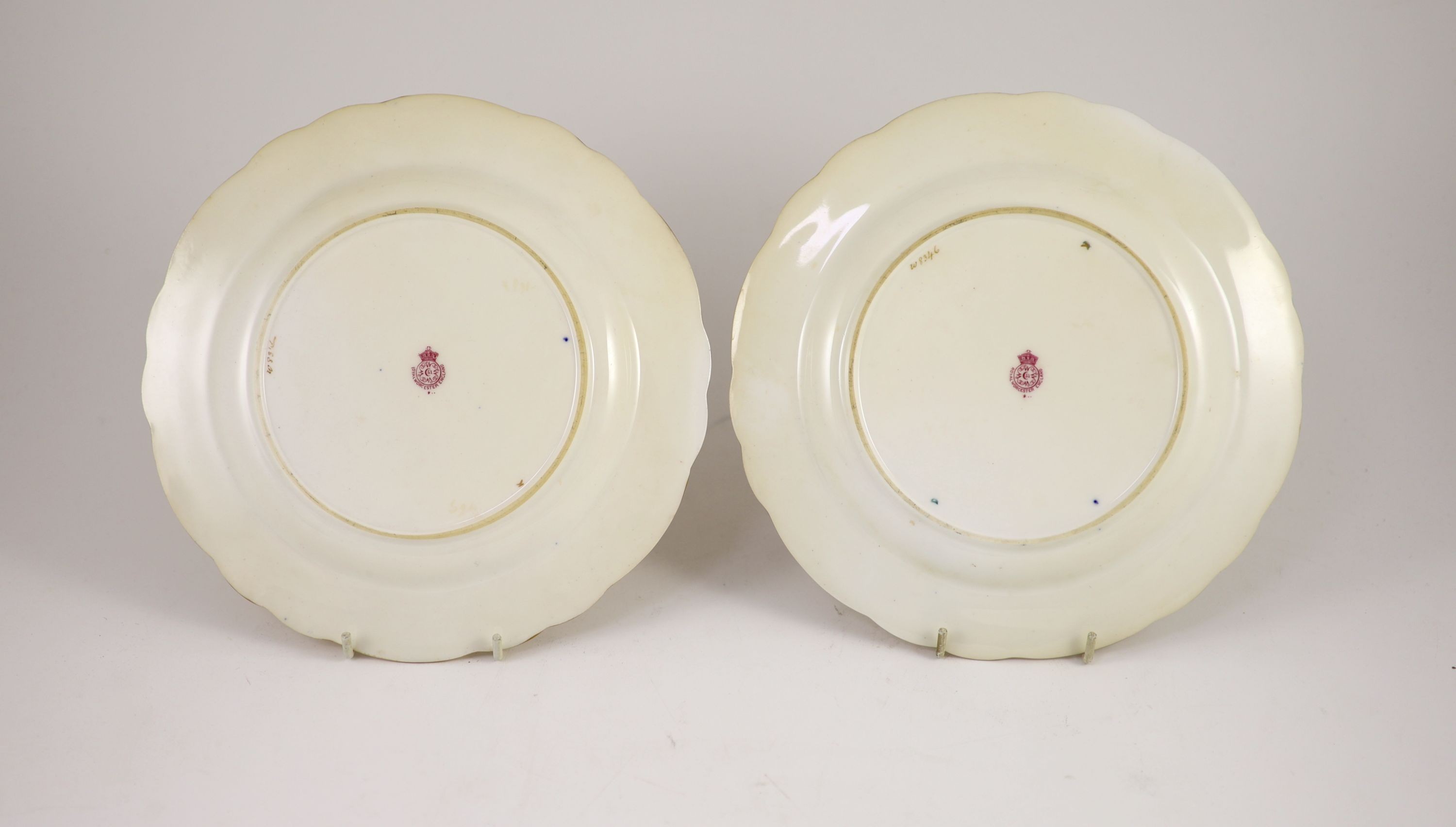 A pair of Royal Worcester fruit painted dessert plates, signed E. Phillips, c.1918, 22.5cm diameter